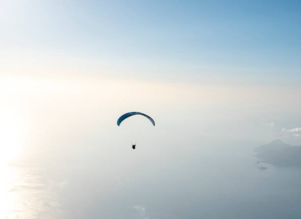 istock Paraglider flying over Babadag Mount in Oludeniz 1304565706