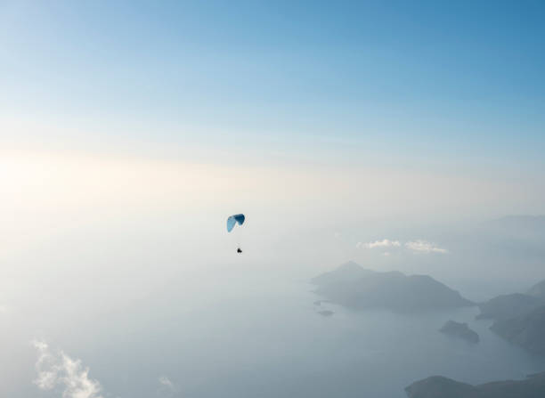 istock Paraglider flying over Babadag Mount in Oludeniz 1304565806