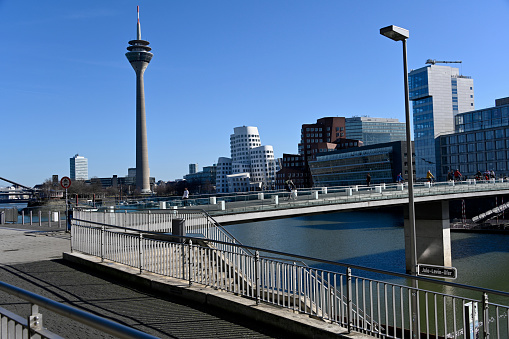 Düsseldorf, Germany, 21 February 2021 - View of the Duesseldorf Media Harbor with Gehry buildings in the Neuer Zollhof and Rheinturm.