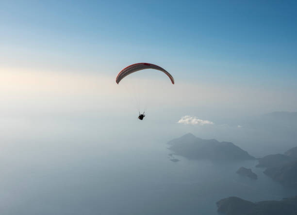 istock Paraglider flying over Babadag Mount in Oludeniz 1304566506
