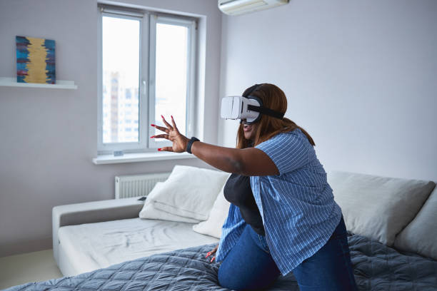 istock Lady staying at home and trying virtual reality device 1304566864