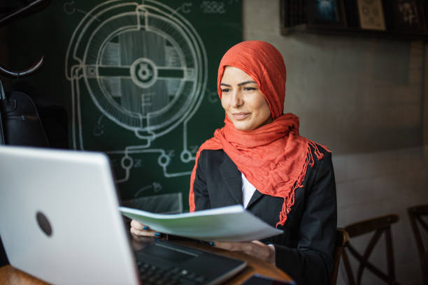 istock Hardworking businesswoman with red hijab 1304568142