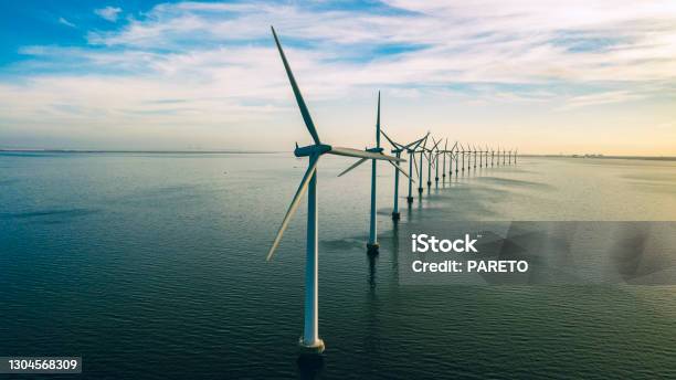 Windmills Of Shore Stock Photo - Download Image Now - Wind Turbine, Sea, Wind Power