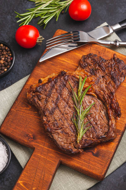 istock T-bone grilled beef steak with spices and herbs 1304571205