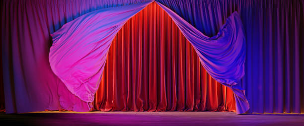 istock Theater stage with colour lightings. Theater curtains in motion. 1304572213