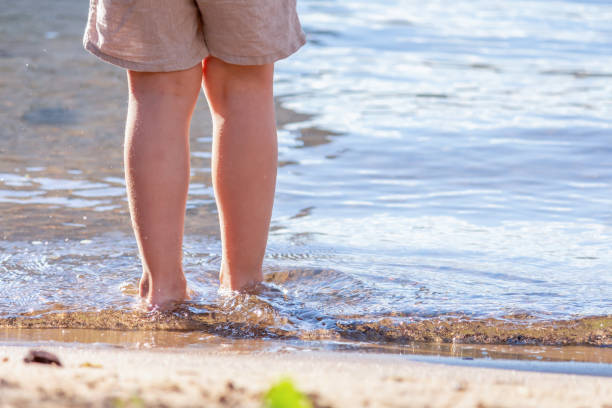 istock little boy on the beach 1304574781