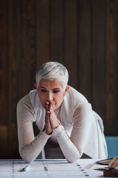 istock Elegant Senior Woman Architect Working on her Project in the Office 1304574818