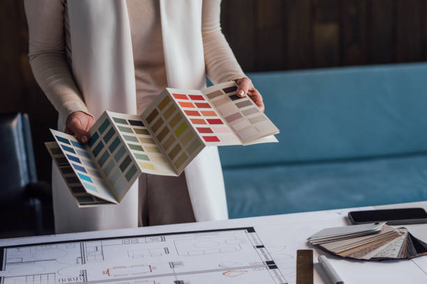 Choosing the Right Color: Anonymous Female Architect Working on a Project in her Office
