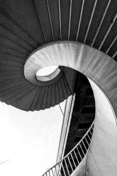 istock white spiral staircase in perspective from below 1304577904