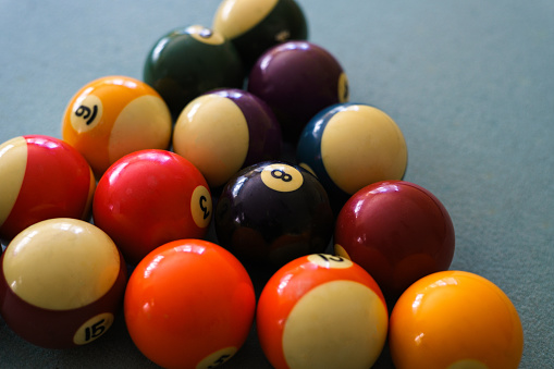 Pool Balls with Focus on 8 Ball - Closeup detail.