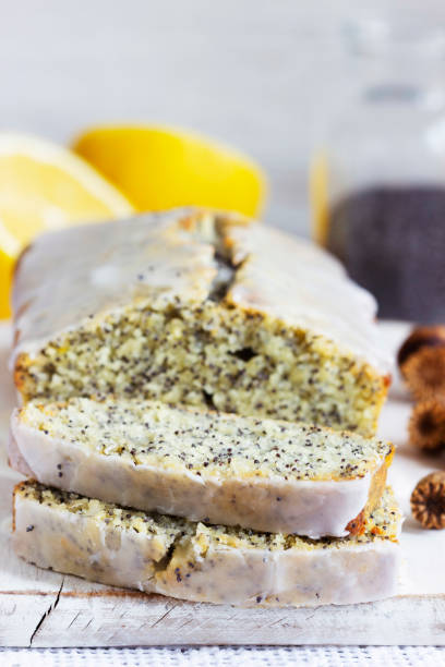 istock Lemon cake with poppy seeds, covered with glaze on a light background. 1304578721
