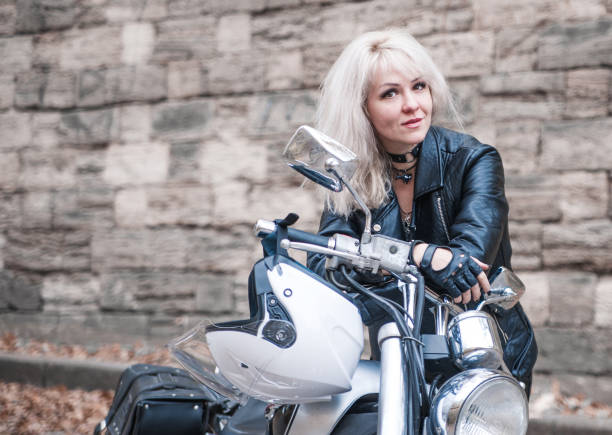 Beautiful biker woman outdoor.