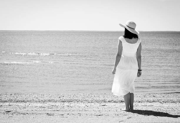 istock Woman at beach 1304581327