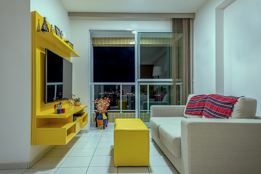 Recife,Pernambuco, Brazil:Living room and balcony of  cozy residential building in Boa Viagem residential area.