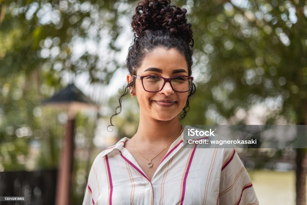 Portrait of young woman smiling One Woman Only Stock Photo