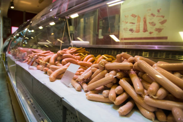 A pitcher’s market in Cádiz, Spain with his display of sausages, chickens and beef