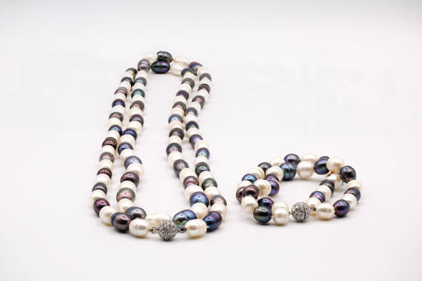 istock Beautiful pearl necklace on white background 1304585286