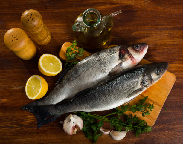 istock Branzino fish on cutting board 1304586055