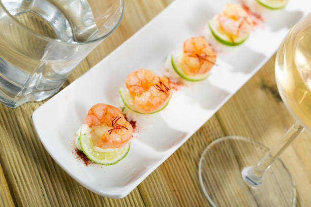 istock Roasted prawns on rice with saffron and lime 1304587123