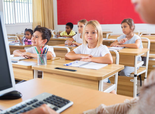 istock Group of focused children working at class 1304588744