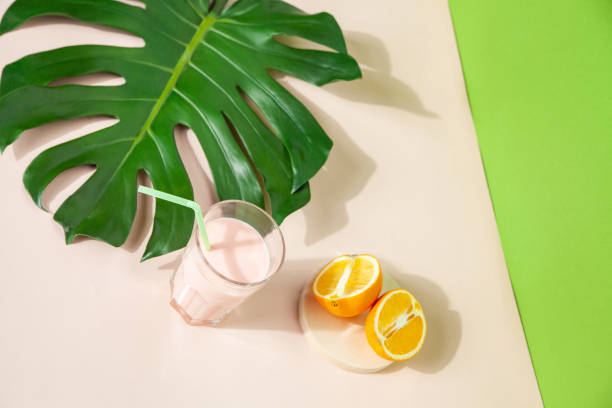 istock Tasty smoothie in glass on table on green background 1304588968