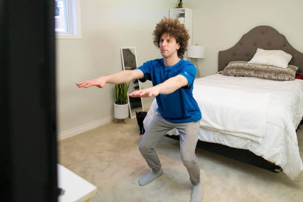 istock Young Man Doing Home Fitness 1304589566