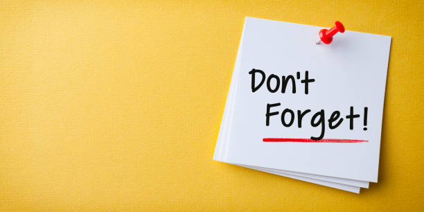 istock White Sticky Note With Don't Forget And Red Push Pin On Yellow Background 1304590789