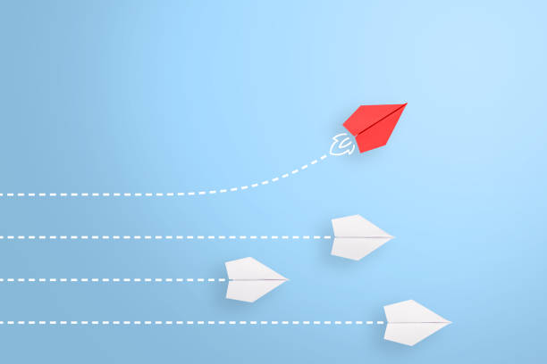 istock Change concepts with red paper airplane leading among white 1304591064