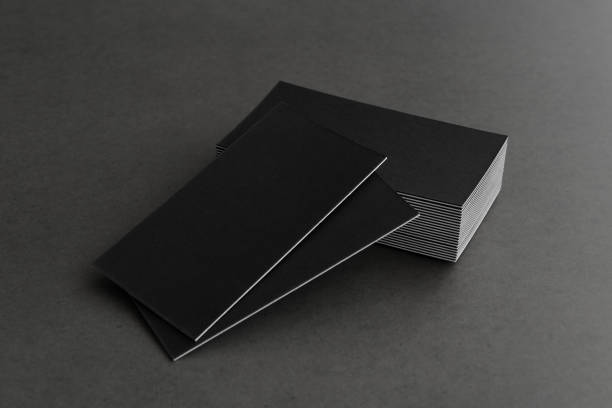 istock Business card on black background. 1304593887