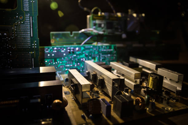 istock Stylized photo of an electronic microcircuit. Microcircuit, contacts, electronics, motherboard. Black background. Macro photography of electronic devices. 1304594201