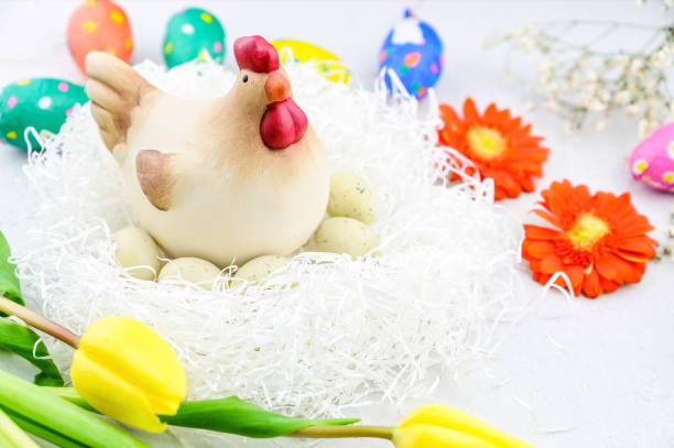 istock Easter greeting card with chiken and Easter eggs in a nest 1304595371