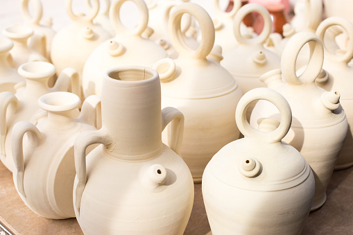 Close-up background of white clay jugs, traditional Spanish home utensils