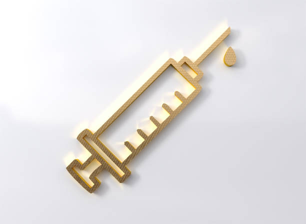 Golden syringe symbol golden vaccination emblem on white wall stock photo