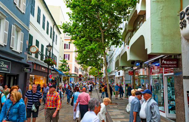 Street scene in Gibraltar Gibraltar, UK - May 24, 2017: Street scene in downtown during busy morning hours gibraltar street stock pictures, royalty-free photos & images