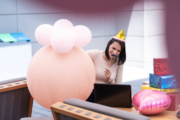 istock Women celebrating father's day by video call 1304599626