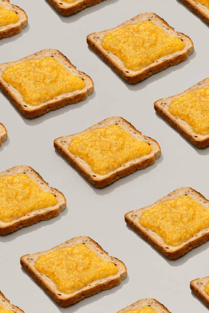 istock Pattern with toast and lemon jam on gray background 1304600994