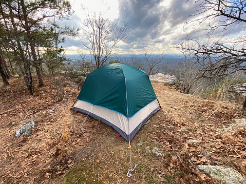 Dome camping tent on high overlook in wilderness
