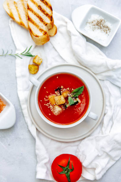 istock Fresh Cold tomato soup with bread on table. Summer Spanish food. Top view, copy space 1304604889