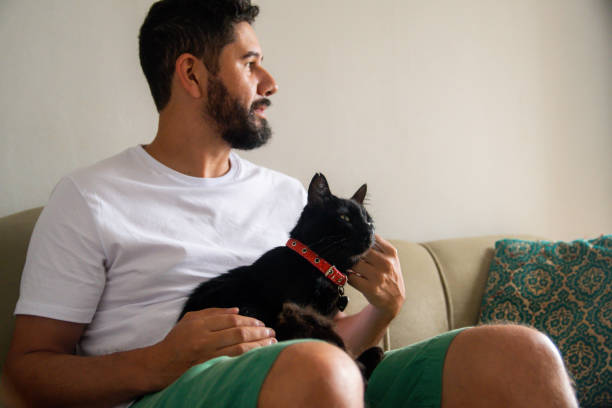istock Man with his pet cat. 1304605091