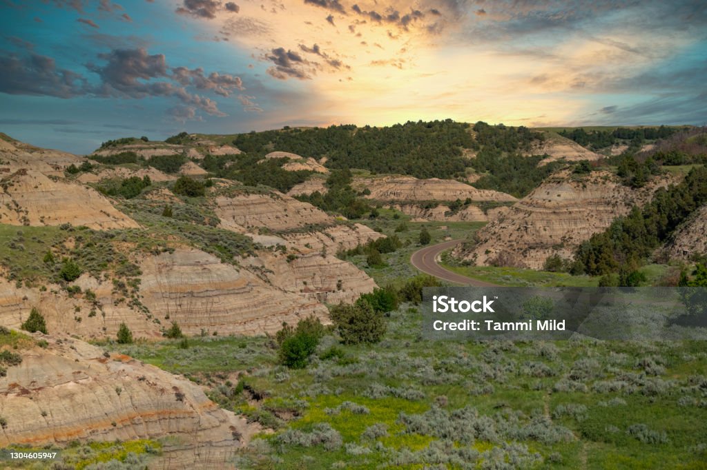 Sunset over the North Dakota Badlands Dramatic sky over the land. Rock formations Extreme terrain. ￼ North Dakota Stock Photo