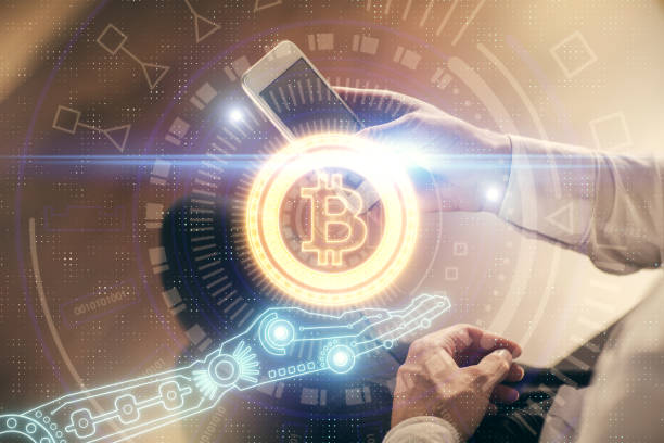 istock Double exposure of man's hands holding and using a phone and crypto currency blockchain theme drawing. 1304606019