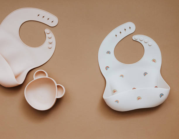 istock silicone dishware on light background. Serving baby, first feeding concept. Flat lay, copy space, top view 1304606054