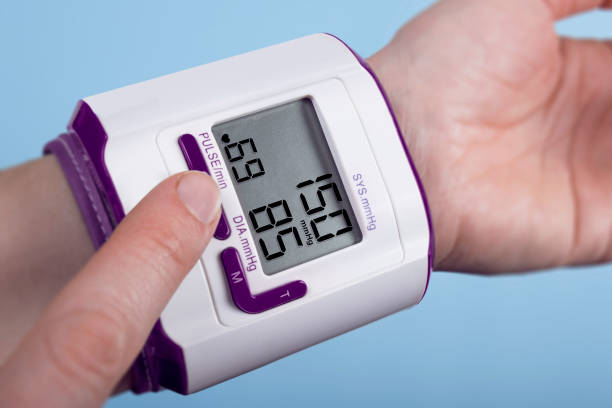 istock Measuring blood pressure on blue backgound 1304606989