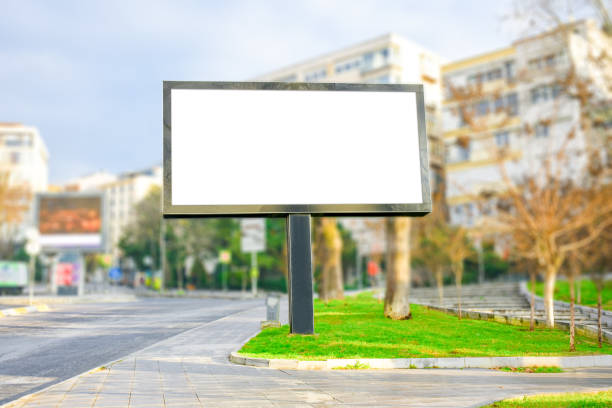 istock Blank billboard mock up, public information board with copy space on the street. 1304606996