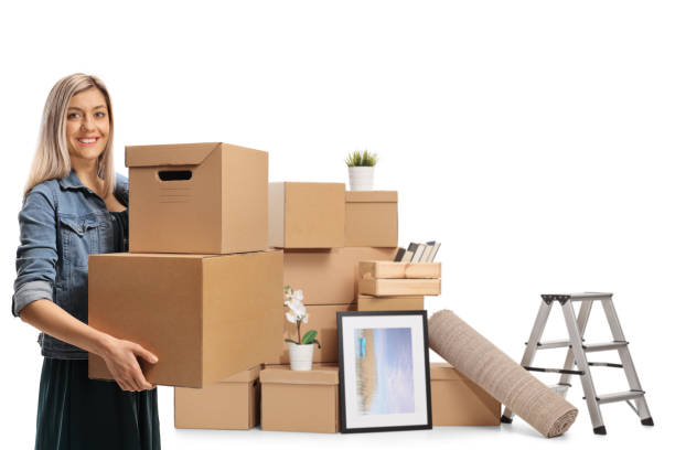 istock Young woman with packed cardboard boxes for home removal 1304609775