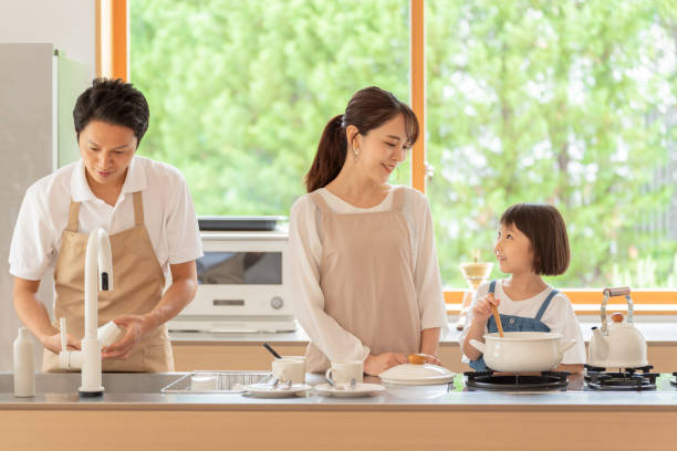 istock young japanese family cooking in kitchen 1304611872