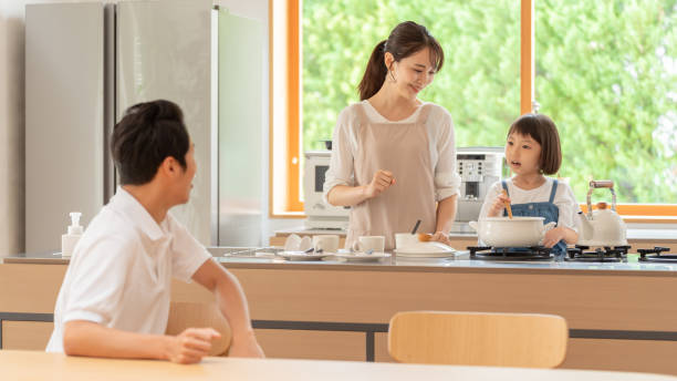 istock young japanese family cooking in kitchen 1304611882
