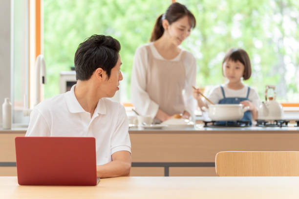 istock young japanese family relaxing in kitchen 1304611896