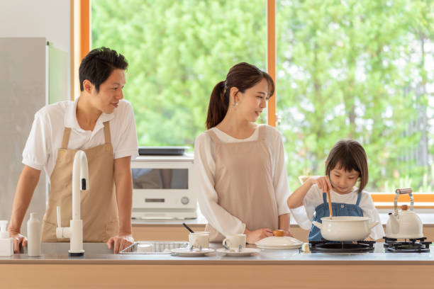 istock young japanese family cooking in kitchen 1304611931