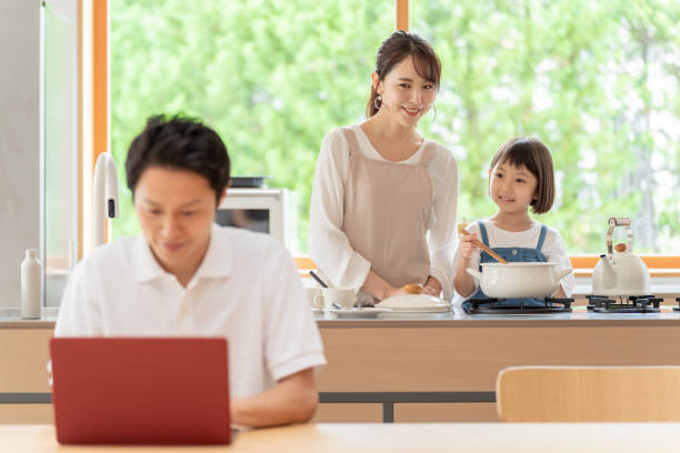 istock young japanese family relaxing in kitchen 1304611932